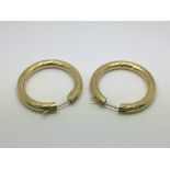 A pair of 9ct gold hoop earrings, approx 7.8g.