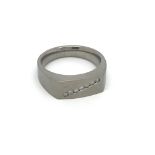 A titanium ring set with seven small diamonds, app