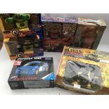 A collection of boxed toys , including Rumble Robots , Me-Fisto and Bolt man. Robo machine,