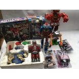 A box containing a collection of boxed/loose robots, including boxed Robo machine battle suit,