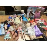 A collection of boxed and loose dolls including Barbie etc