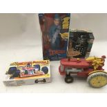 A box containing a boxed Thunderbirds, Scott Tracy 12"figure, a product enterprise Talking Dalek ,