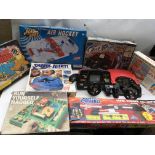 A box containing Grandstand Outrun , electronic racing game and a similar Ferrari game, Air