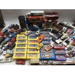 A box containing a collection of boxed and loose Diecast vehicles including Matchbox, Corgi, Buddy L