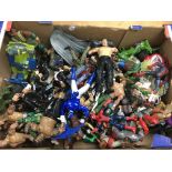 A box containing a collection of Action figures including WWE, Turtles, Ghostbusters, Spiderman etc