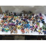 A collection of action figures, in playworn condit
