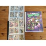 A collection of trading cards including Turtles, D