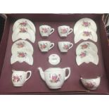 A boxed child's tea set, stamped Made in England, with transfer printed pattern of flowers, boxed