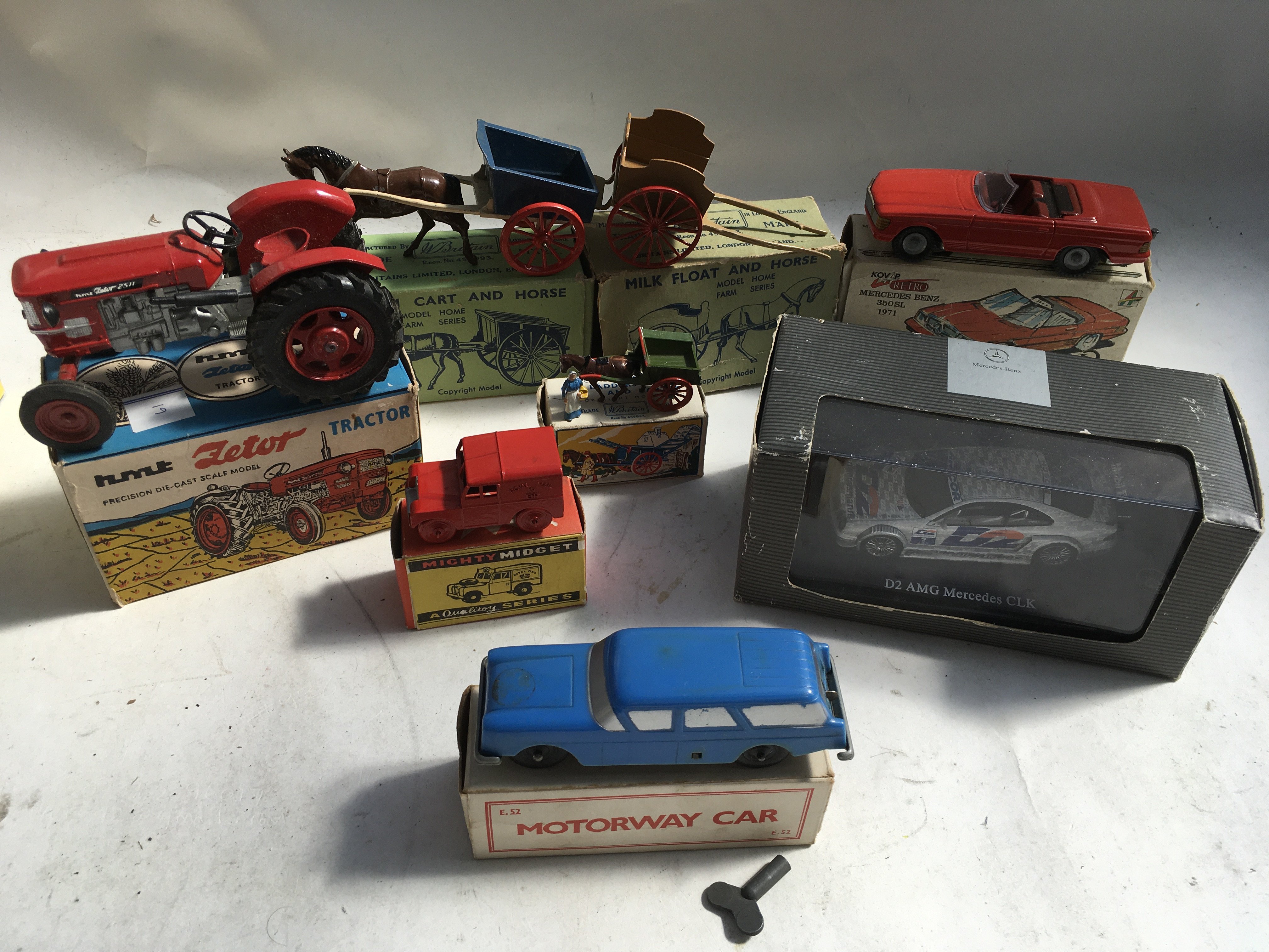 A box containing a collection of boxed Diecast vehicles including Zetor toys tractor ,Britains