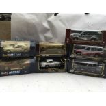 A collection of boxed 1:18 scale Diecast vehicles including Revell Mercedes Benz 500SL coupe and a