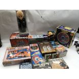 A box containing a collection of boxed toys including a UFO, Spirograph, Walkie talkies and lots