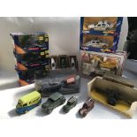 A box containing a collection of boxed Diecast vehicles including corgi toys , London taxi x3, Corgi