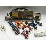 Scalextric, a box containing a collection of loose cars, a boxed Trackside accessory pack , a