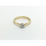 An 18carat gold ring set with a solitaire diamond