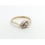 A Vintage gold ring with a two stone crossover a r