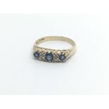 A 9carat gold ring set with sapphire and small diamonds ring size L-M
