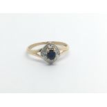 A 9carat gold ring set with a sapphire and chip diamonds ring size M.