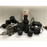 A good collection of cameras And lenses inc zenit E, Olympus, Lubitel etc.