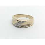 A 9carat gold ring set with a row of diamonds ring size R-S