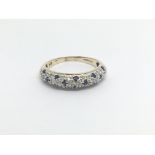 A 9carat gold ring set with a pattern of sapphire