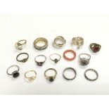 A collection of 15 costume rings.