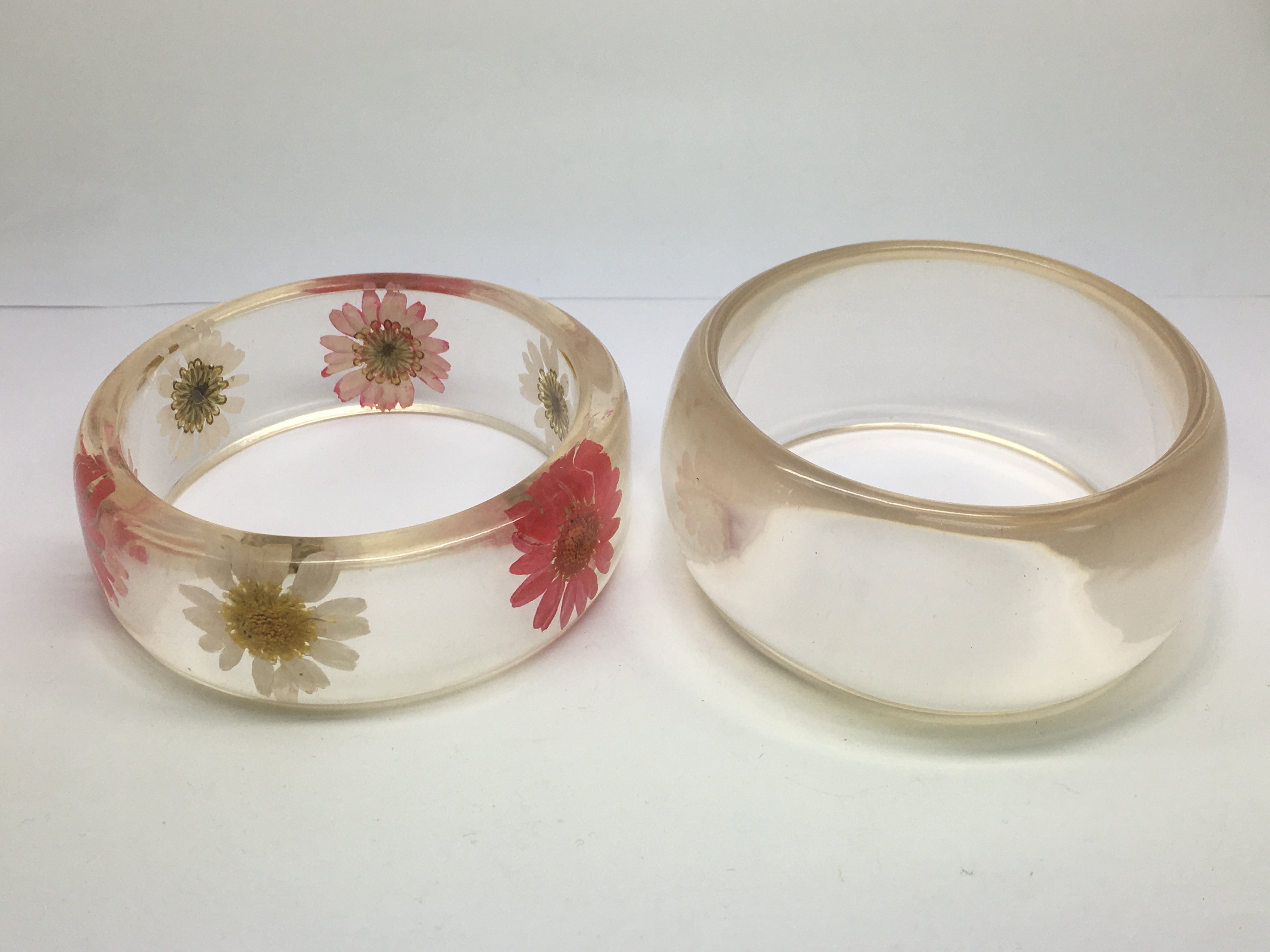 Two vintage perspex bracelets.