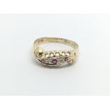 A 9carat gold ring set with a pattern of ruby and diamonds ring size O.