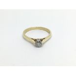An 18carat gold ring set with a solitaire brillian