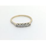 A 1950s 18carat gold ring set with a row of five d