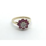 A 9carat gold ring setvwith a flower pattern of ru