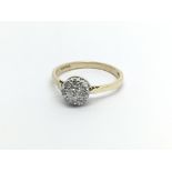 A 9carat gold ring set with a cluster of diamonds