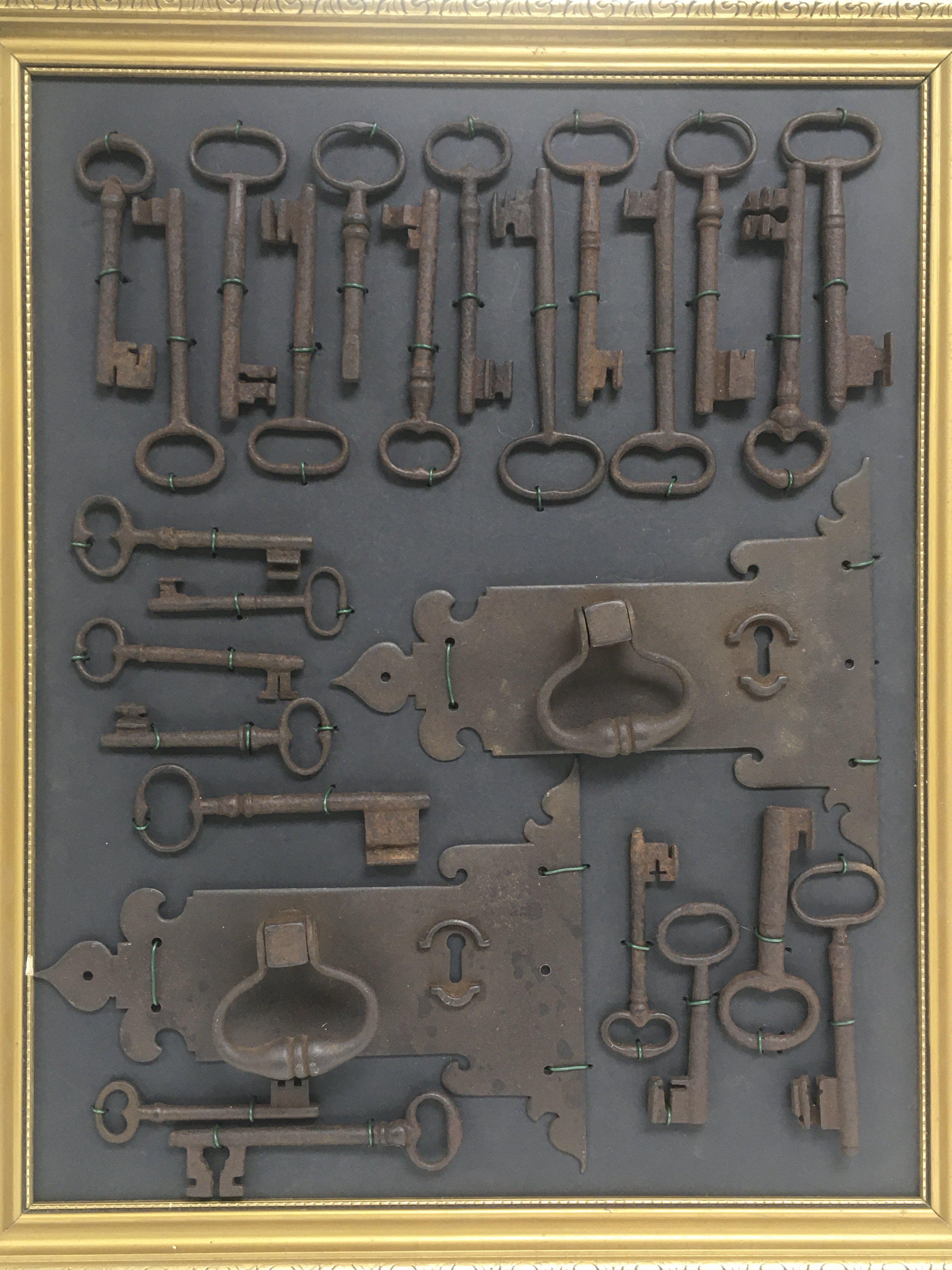 A collection of 24 Georgian keys and two lockplate