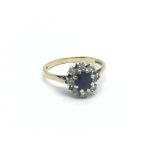 A 9carat gold ring set with a sapphire and pattern