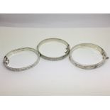 Three silver bracelets with chased decoration, two with Birmingham hallmarks, one for Chester.