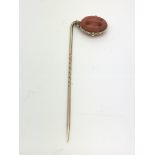 A Victorian gold and coral pulley stick pin, appro