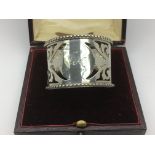 A cased Edwardian silver napkin ring, Birmingham 1