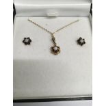 A 9 ct gold necklace and earring set inset with sa