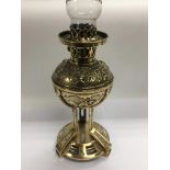 An Arts & Crafts brass oil lamp.