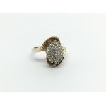 A 9carat gold ring set with a cluster pattern of d