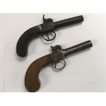 Two antique percussion cap pocket pistols.