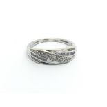 A 9carat white gold ring set with a pattern of diamonds ring size N-O.