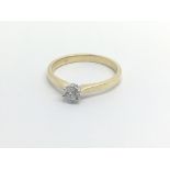 An 18carat gold ring set with a solitaire ring 0.1