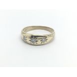 A 9carat gold Gypsy type ring set with three diamo