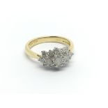 An 18carat gold ring set with a cluster of diamond