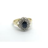 An 18carat gold ring set with a blue sapphire flan