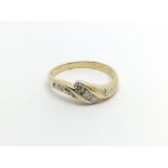 An 18carat gold ring set with brilliant cut diamon