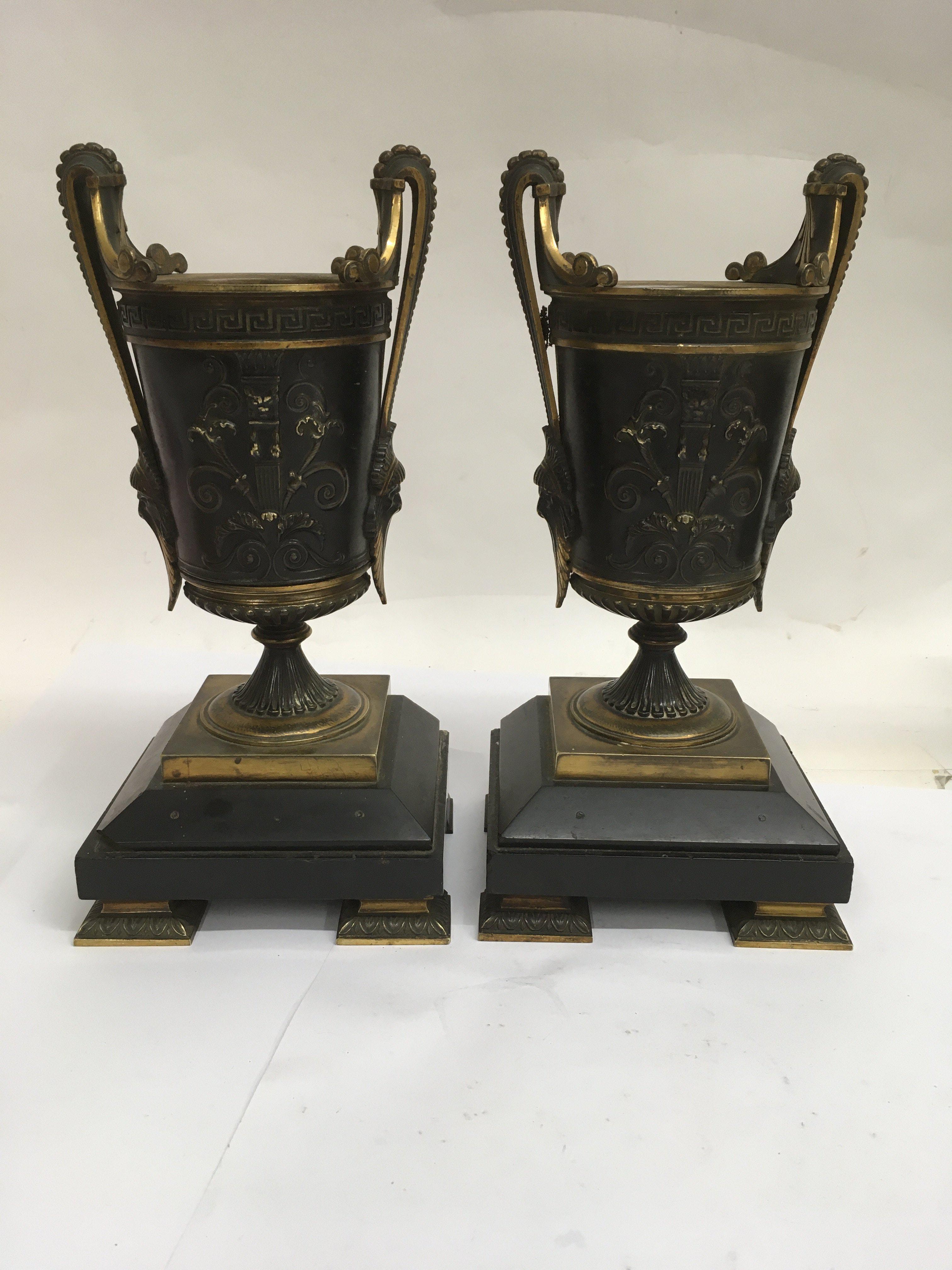 A pair of French bronze parcel gilt vases of Class