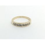 An 18carat gold ring setvwith a row of brilliant c