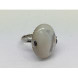 A silver and mother of pearl ring, approx size S.