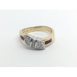 An 18carat gold ring set with a pattern of diamonds and ruby ring size O